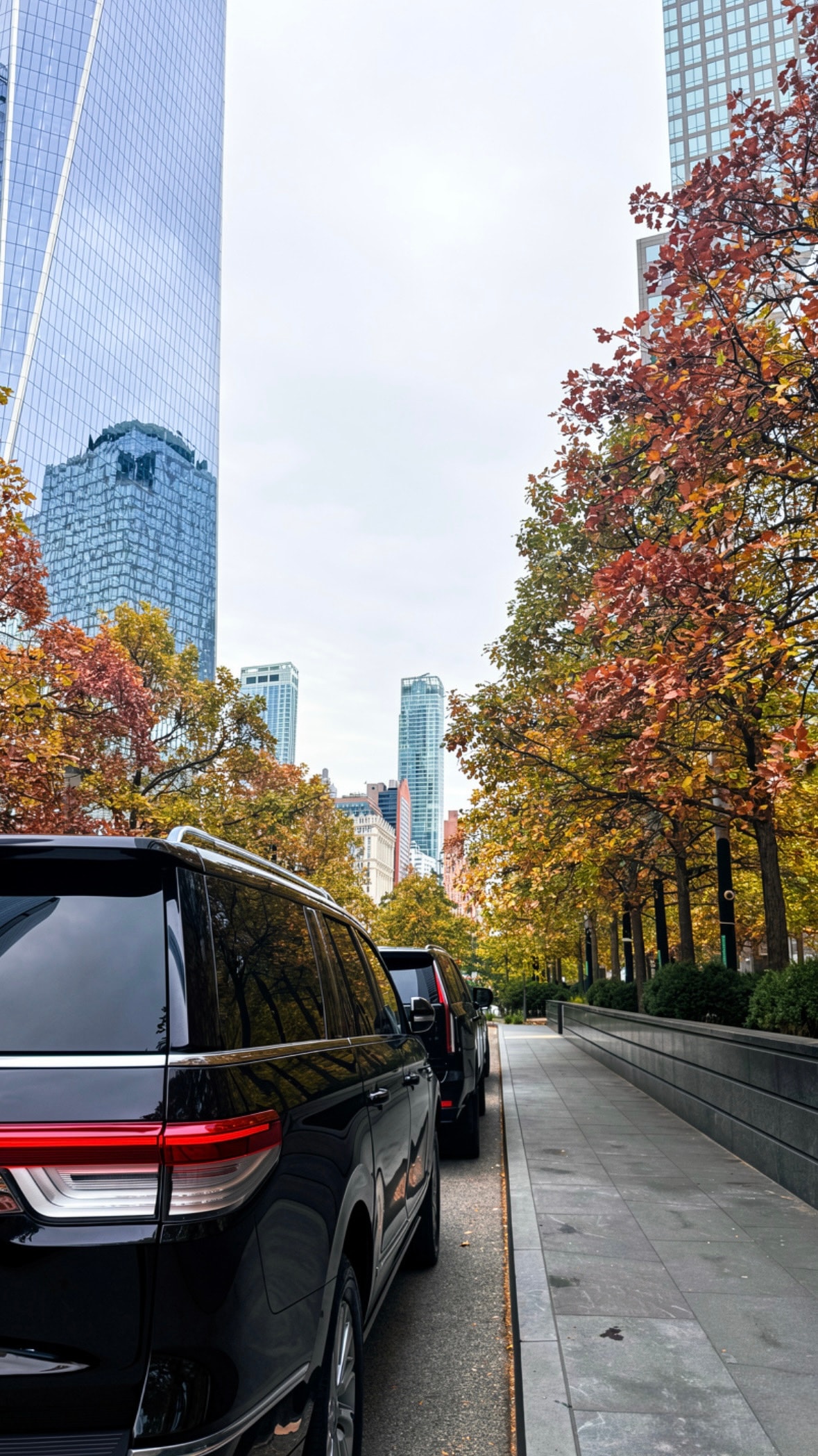 Luxury black SUV fleet on Brooklyn Bridge, New York City